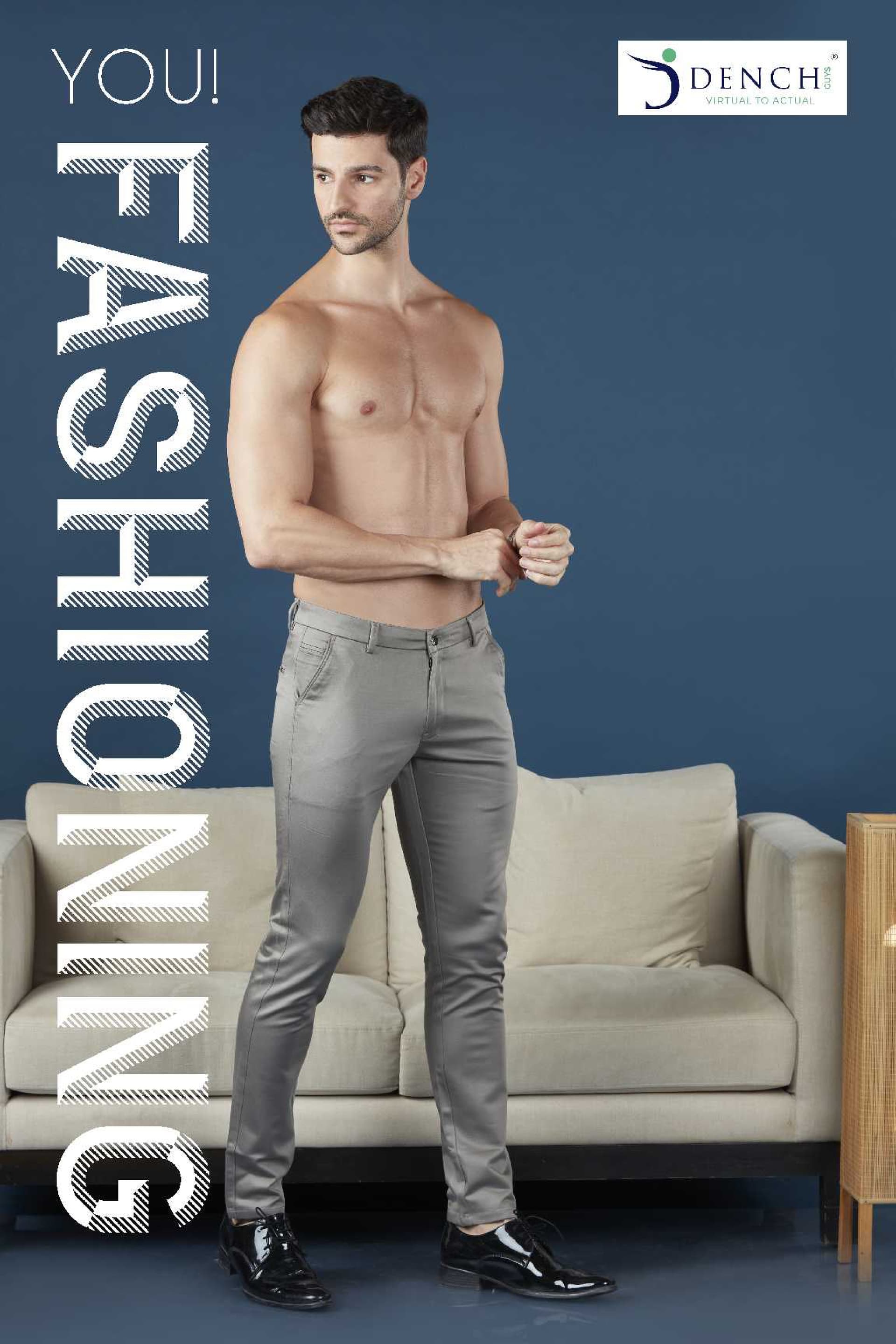 Steel grey formal trousers on model, standing beside sofa
